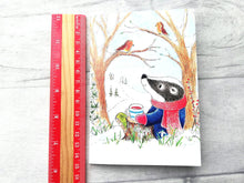 Load image into Gallery viewer, A badger A6 notebook next to a ruler as a size guide