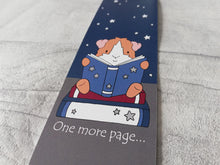Load image into Gallery viewer, Guinea pig bookmark, little ginger and white guinea pig sat on a book reading with the wording one more page underneath