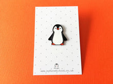 Load image into Gallery viewer, Black and white penguin enamel pin on a grey and white polka dot backing card