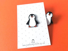 Load image into Gallery viewer, Black and white penguin enamel pin on a grey and white polka dot backing card
