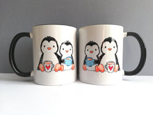 Load image into Gallery viewer, Two mugs with two little penguins sat having a cup of tea
