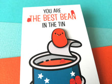Load image into Gallery viewer, Best bean enamel pin close up, funny positive gift, mini enamel baked bean brooch on a backing card with the words you are the best bean in the tin