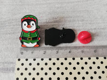 Load image into Gallery viewer, Elf penguin enamel pin next to a ruler as a size guide