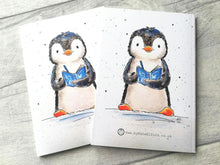 Load image into Gallery viewer, A penguin notebook, this is showing that it is the same matching design on both sides