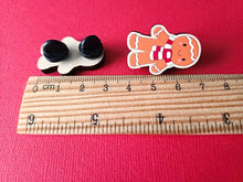 Load image into Gallery viewer, Christmas gingerbread pin next to a ruler as a size guide it measures around 3cm tall