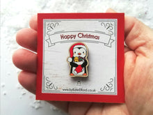 Load image into Gallery viewer, Christmas penguin wooden pin brooch, Cute little penguin badge, holding a Christmas stocking, eco friendly wood