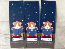 Load image into Gallery viewer, Guinea pig bookmarks. A night sky design, with a guinea pig sat on a book reading. The words one more page are at the bottom of the bookmark