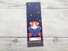 Load image into Gallery viewer, Guinea pig bookmark, a guinea pig sat on a book reading a book, with a starry sky behind. The wording on the bottom of the bookmark says one more page