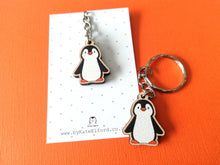 Load image into Gallery viewer, Cute mini penguin keyring on a grey and white polka dot backing card
