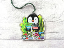 Load image into Gallery viewer, Penguin and house plants recycled acrylic hanging ornament. Cute plant gift