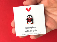 Load image into Gallery viewer, Little penguin and red or pink glitter heart pin. Cute penguin enamel pin. Sending love and a penguin