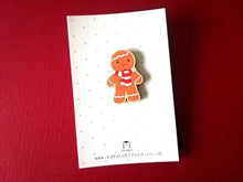 Load image into Gallery viewer, Christmas gingerbread pin, wooden pin brooch, Responsibly resourced wood, eco friendly on a grey and white polka dot backing card
