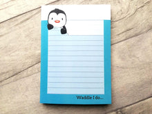 Load image into Gallery viewer, Small lined notepad. There is a little penguin drawing at the top and the words waddle I do at the bottom.
The border is a turquoise colour