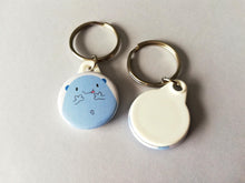 Load image into Gallery viewer, Front and back of a cute blue worry gobbler keyring. The back is plain white