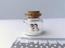 Load image into Gallery viewer, Miniature penguin Christmas decoration. Little pottery penguins in a glass bottle. Christmas, valentine penguin mini ornament
