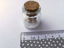 Load image into Gallery viewer, Miniature penguin Christmas decoration. Little pottery penguins in a glass bottle. Christmas, valentine penguin mini ornament