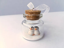 Load image into Gallery viewer, Miniature penguin Christmas decoration. Little pottery penguins in a glass bottle. Christmas, valentine penguin mini ornament