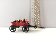 Load image into Gallery viewer, Penguins in a cart. Little pottery penguin in a mini red truck. Cute penguins