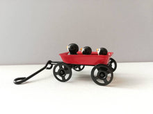 Load image into Gallery viewer, Penguins in a cart. Little pottery penguin in a mini red truck. Cute penguins