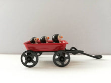 Load image into Gallery viewer, Penguins in a cart. Little pottery penguin in a mini red truck. Cute penguins