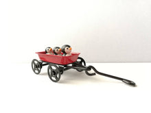 Load image into Gallery viewer, Penguins in a cart. Little pottery penguin in a mini red truck. Cute penguins