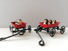 Load image into Gallery viewer, Penguins in a cart. Little pottery penguin in a mini red truck. Cute penguins
