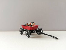 Load image into Gallery viewer, Penguins in a cart. Little pottery penguin in a mini red truck. Cute penguins