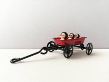 Load image into Gallery viewer, Penguins in a cart. Little pottery penguin in a mini red truck. Cute penguins