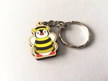 Load image into Gallery viewer, Tiny penguin bee keyring, mini penguin wooden key fob, ethically sourced wood, Boo the penguin dressed as a bee, eco friendly