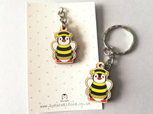 Load image into Gallery viewer, Tiny penguin bee keyring, mini penguin wooden key fob, ethically sourced wood, Boo the penguin dressed as a bee, eco friendly
