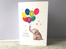 Load image into Gallery viewer, Birthday card. There is a picture of an elephant holding rainbow coloured balloons. The balloons have happy faces. The wording on the card says happy birthday