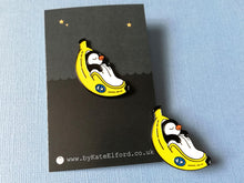 Load image into Gallery viewer, Penguin pin, penguin sleeping in a banana enamel pin, banana moon, fruit, food enamel badge