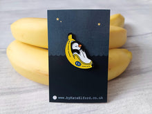 Load image into Gallery viewer, Penguin pin, penguin sleeping in a banana enamel pin, banana moon, fruit, food enamel badge
