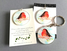 Load image into Gallery viewer, Recycled acrylic robin keyrings. There is a choice of a plain backing card or one with the wording when a robin appears around you, it's just to say hello, and tell you that you're always loved, more than you'll ever know