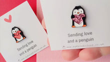 Load and play video in Gallery viewer, Little penguin and red or pink glitter heart pin. Cute penguin enamel pin. Sending love and a penguin