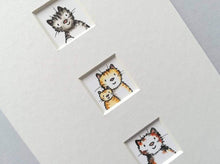 Load image into Gallery viewer, Little apertures in a 7x5 mount, three little windows with cat prints
