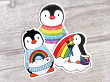 Load image into Gallery viewer, Products Set of three rainbow penguin stickers. Penguin in a rainbow jumper, painting a rainbow and boo the penguin, pride penguins, cute happy designs
