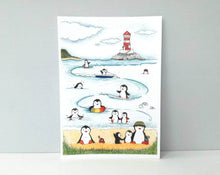 Load image into Gallery viewer, Penguins at the beach print, unframed penguin picture, swimming and surfing at the seaside, lighthouse picture
