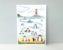 Load image into Gallery viewer, Penguins at the beach print, unframed penguin picture, swimming and surfing at the seaside, lighthouse picture