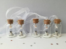 Load image into Gallery viewer, Miniature penguin decoration. Little pottery penguin chick in a glass bottle. Christmas mini penguin ornament