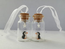 Load image into Gallery viewer, Miniature penguin decoration. Little pottery penguin in a glass bottle. Christmas penguin mini ornament
