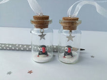 Load image into Gallery viewer, Puffin Christmas decoration. Little pottery puffin in a miniature glass bottle. Mini Christmas puffin ornament