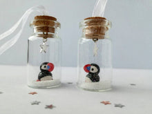 Load image into Gallery viewer, Puffin Christmas decoration. Little pottery puffin in a miniature glass bottle. Mini Christmas puffin ornament
