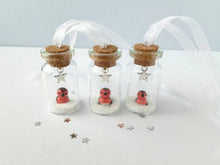 Load image into Gallery viewer, Robin Christmas decoration. Little pottery robin in a mini glass bottle. Miniature Christmas robin ornament
