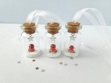 Load image into Gallery viewer, Robin Christmas decoration. Little pottery robin in a mini glass bottle. Miniature Christmas robin ornament