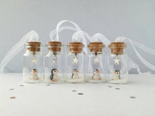 Load image into Gallery viewer, Miniature penguin decoration. Little pottery penguin in a glass bottle. Christmas penguin mini ornament