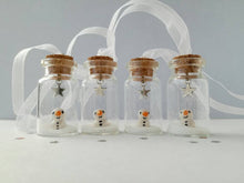 Load image into Gallery viewer, Miniature snowman decoration. Little pottery snowman in a glass bottle. Christmas mini ornament