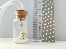 Load image into Gallery viewer, Miniature snowman decoration. Little pottery snowman in a glass bottle. Christmas mini ornament
