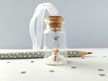 Load image into Gallery viewer, Miniature snowman decoration. Little pottery snowman in a glass bottle. Christmas mini ornament