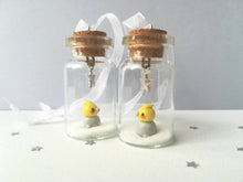 Load image into Gallery viewer, Cockatiel Christmas decoration. Little pottery cockatiel in a miniature glass bottle. Mini Christmas grey and yellow bird ornament